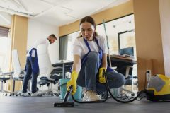 professional-cleaning-service-person-using-vacuum-cleaner-office-2-scaled